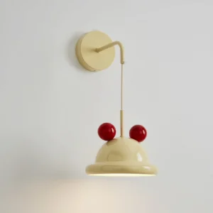 Mid-century modern Aries wall lamp showing curved metal mounting arm, cream finish, and sculptural red ball details against neutral background