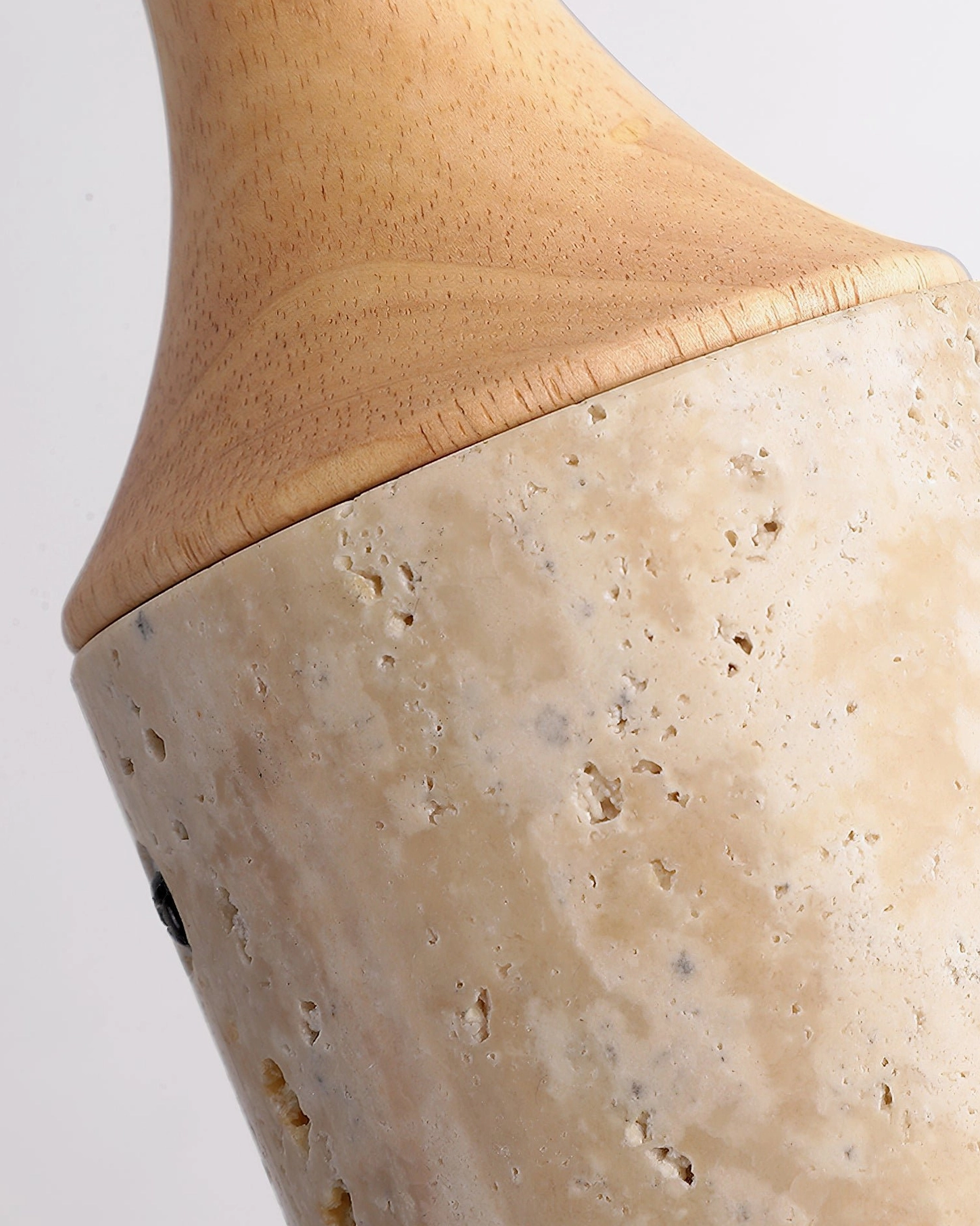 Side view of Arlene travertine cylinder pendant with wood component and electrical hardware