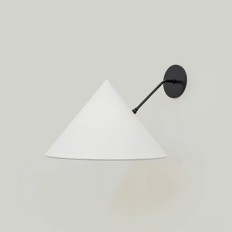 Arno wall sconce in matte black finish with white conical fabric shade, studio photography front view