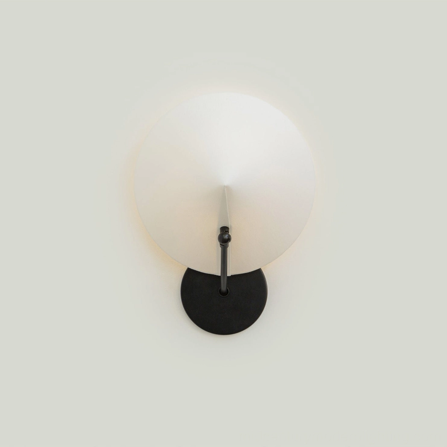 Arno modern wall sconce with geometric conical form, studio lighting on white background