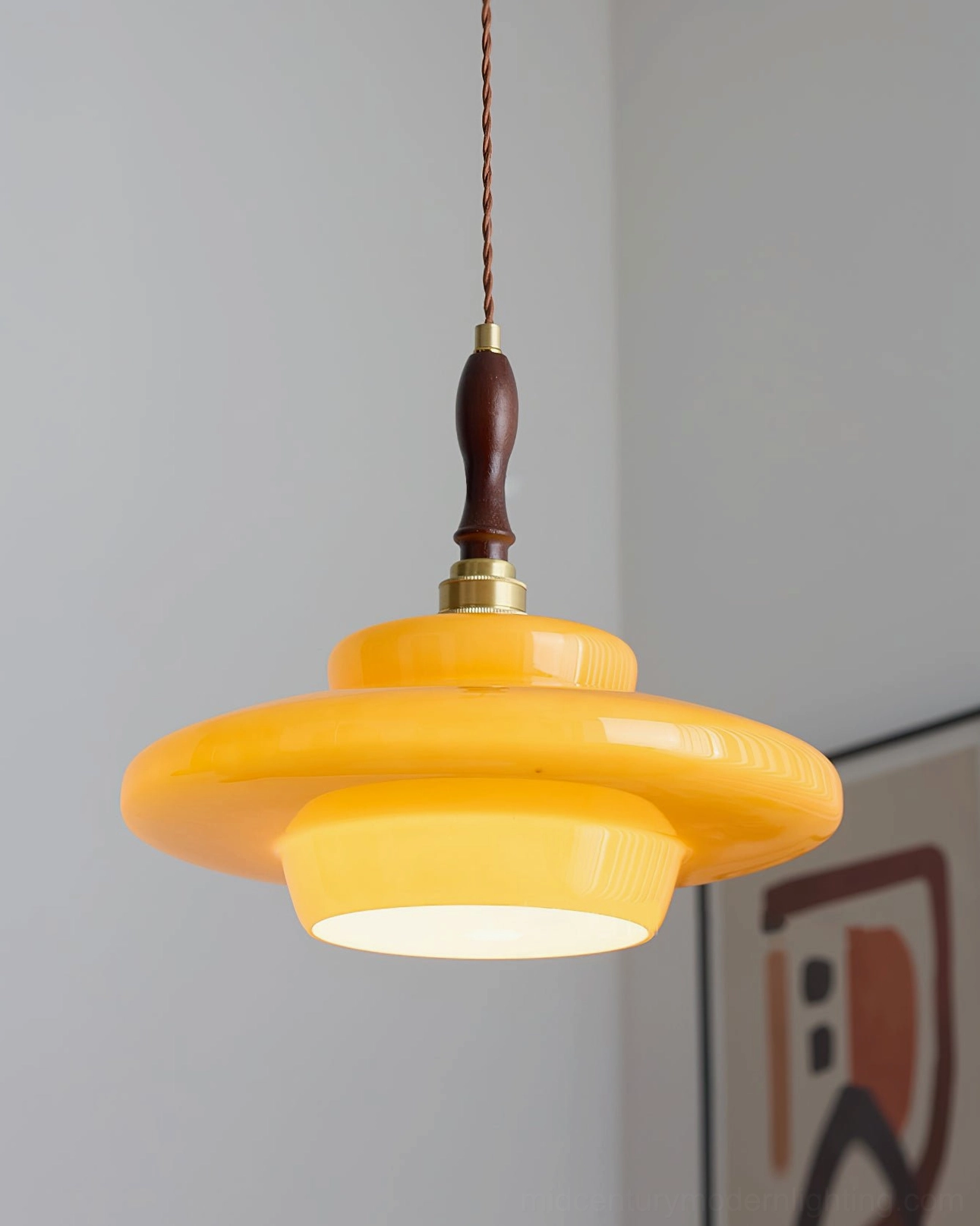 Aroma pendant lamp paired with mid-century furniture and warm color palette home decor styling