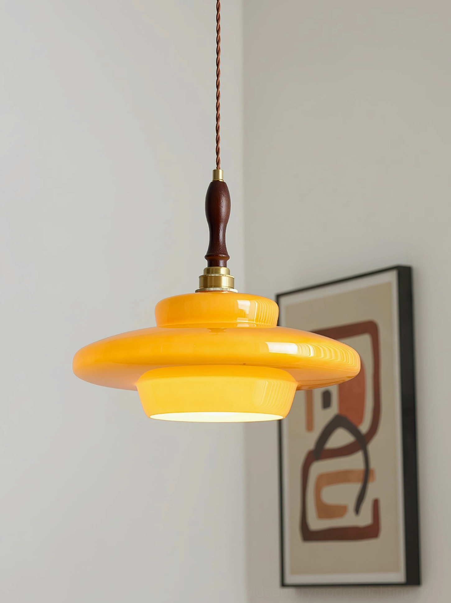 Aroma mid-century modern pendant lamp mounted on wall with framed artwork in vintage home setting