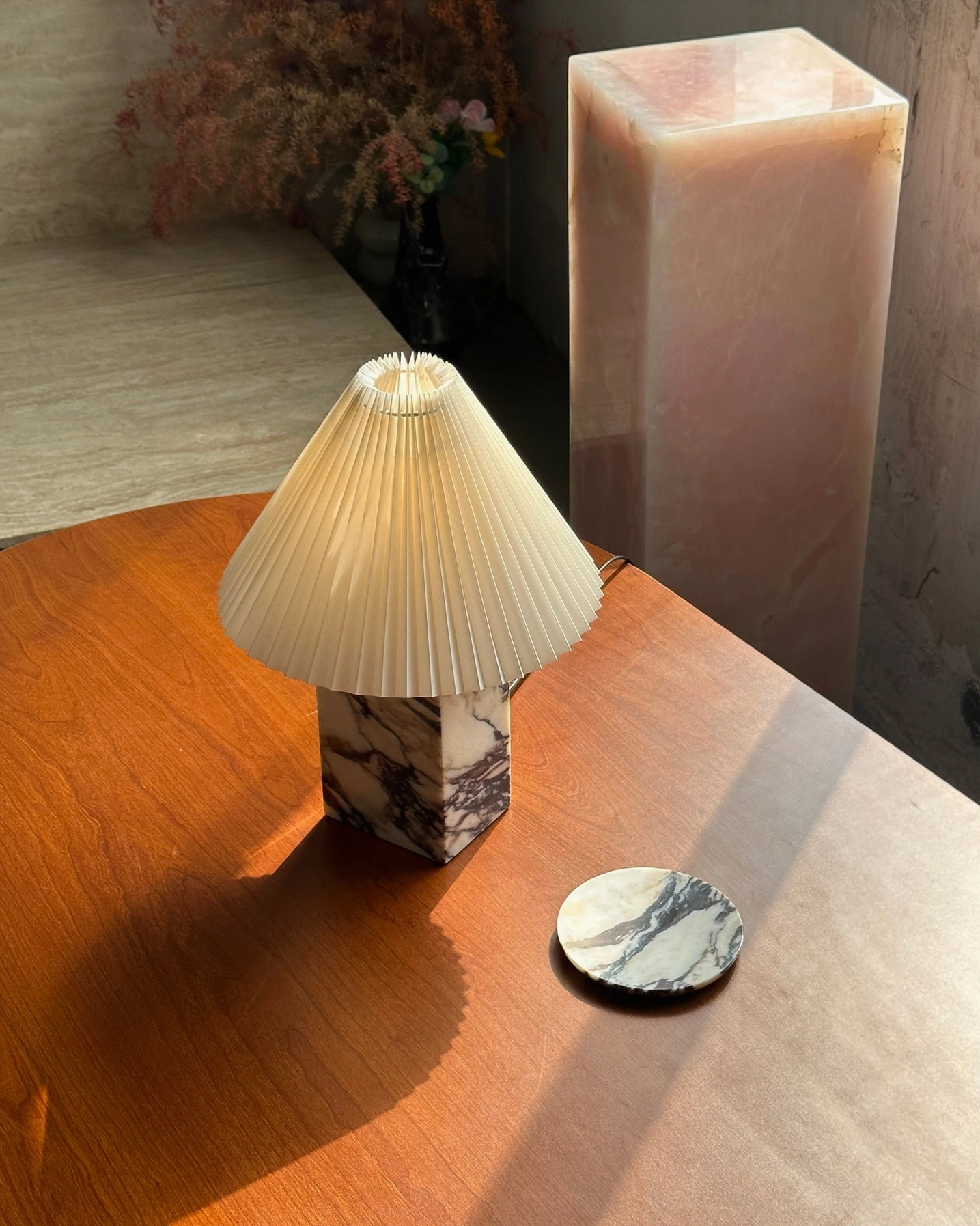Arouca marble table lamp with compact square base and mini pleated shade on wooden table