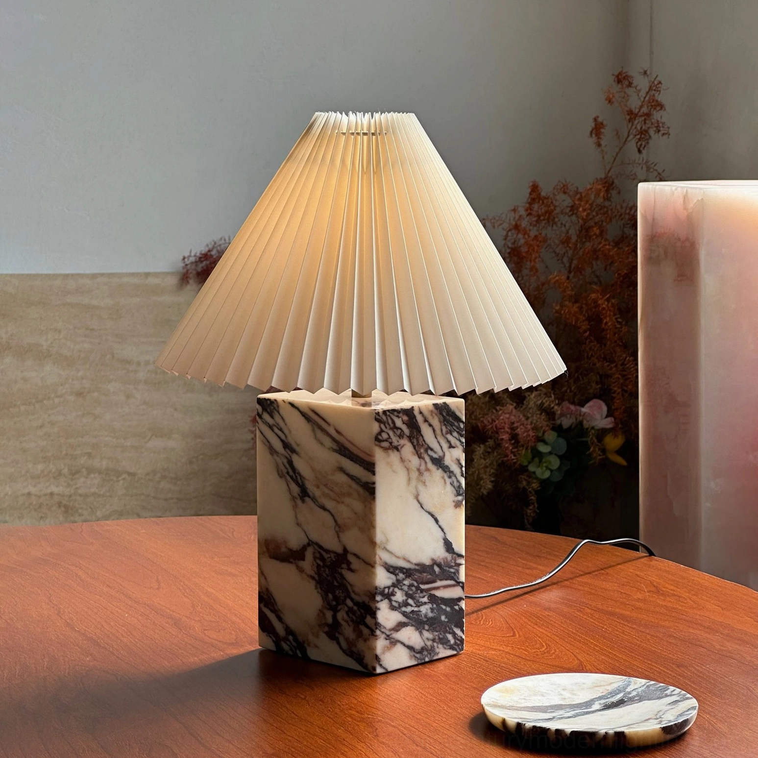 Arouca marble table lamp displayed on warm dining table with marble coaster and ambient lighting