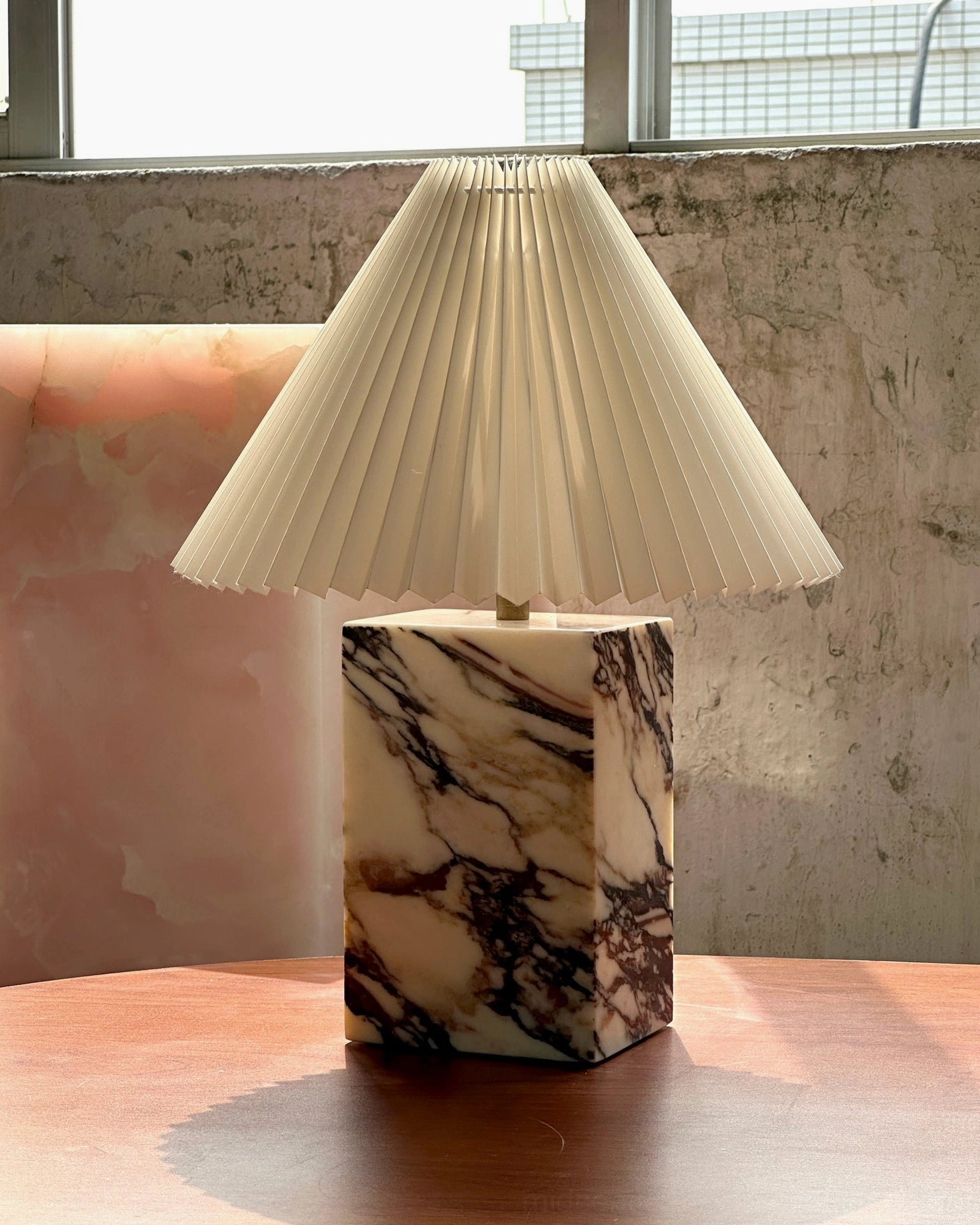 Arouca marble table lamp in industrial-style space with decorative accents and warm ambient glow