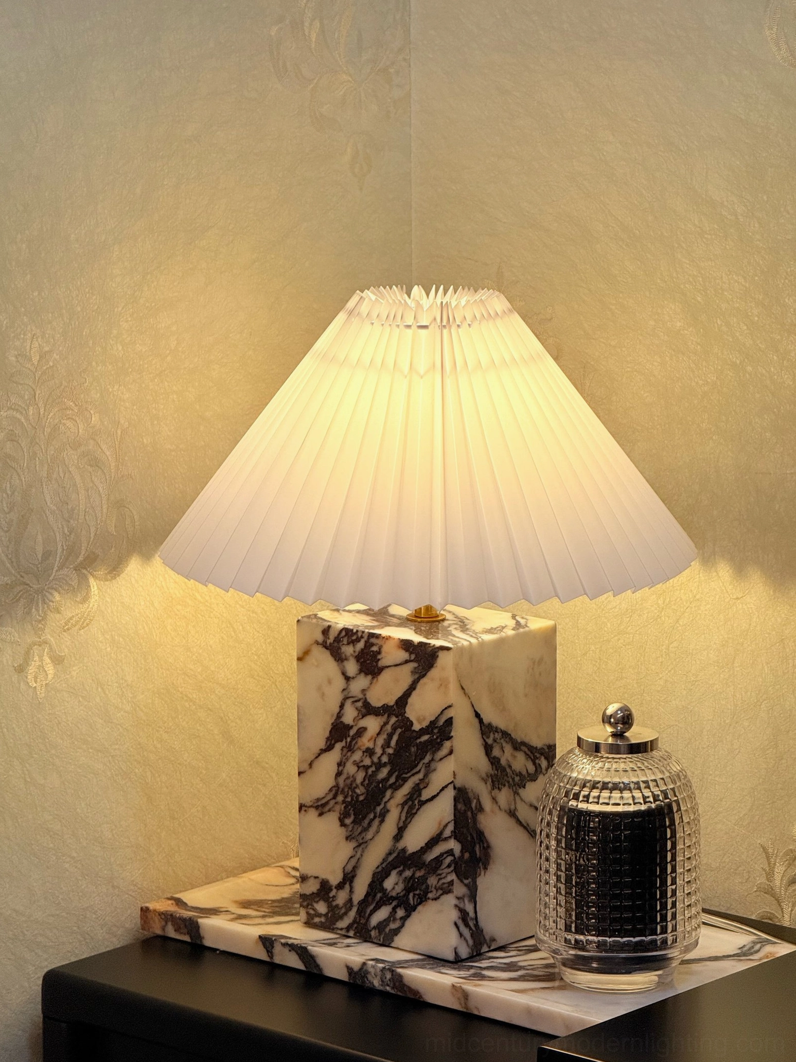 Arouca marble table lamp on decorative tray with ambient warm lighting in home interior corner