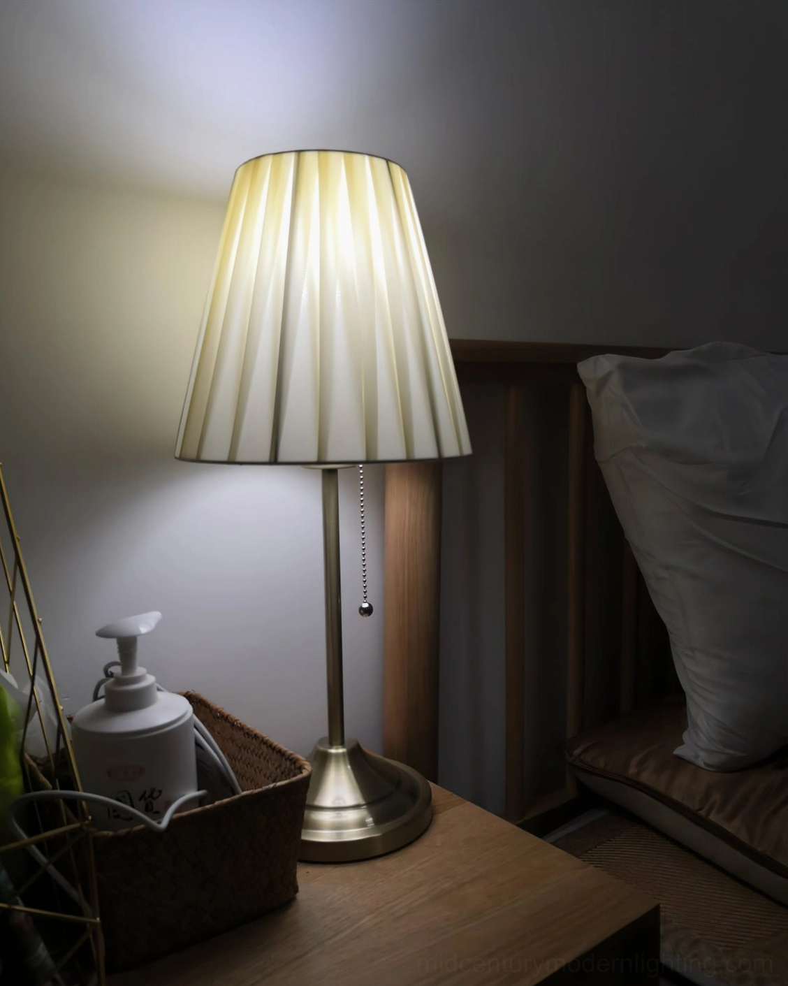 Arstid pleated shade table lamp with gold metal base on luxury living room table with dried flowers