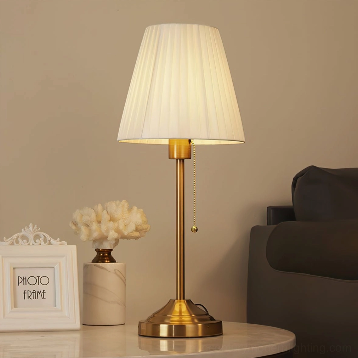 Arstid table lamp detail showing pleated fabric shade texture and premium finish quality