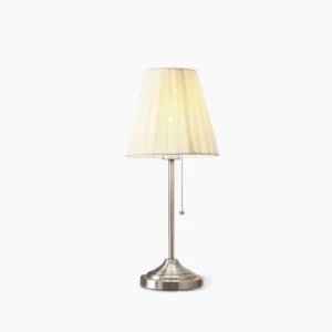 Arstid pleated fabric table lamp with brushed silver metal stand and cream shade, front studio view