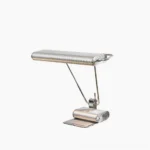 Art Deco 34 chrome adjustable table lamp front three-quarter view showcasing ribbed metal architecture and dual-arm design