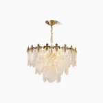 Art Nouveau brass leaves tiered chandelier with three suspended rings and fluted glass palmette pendants, overhead view on white background