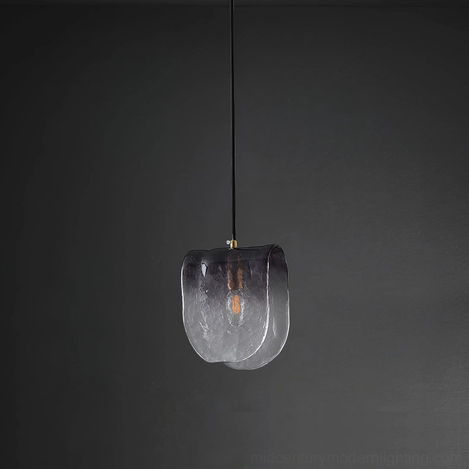 Artisanal pendant light with organic glass shaping and water-ripple texture detail