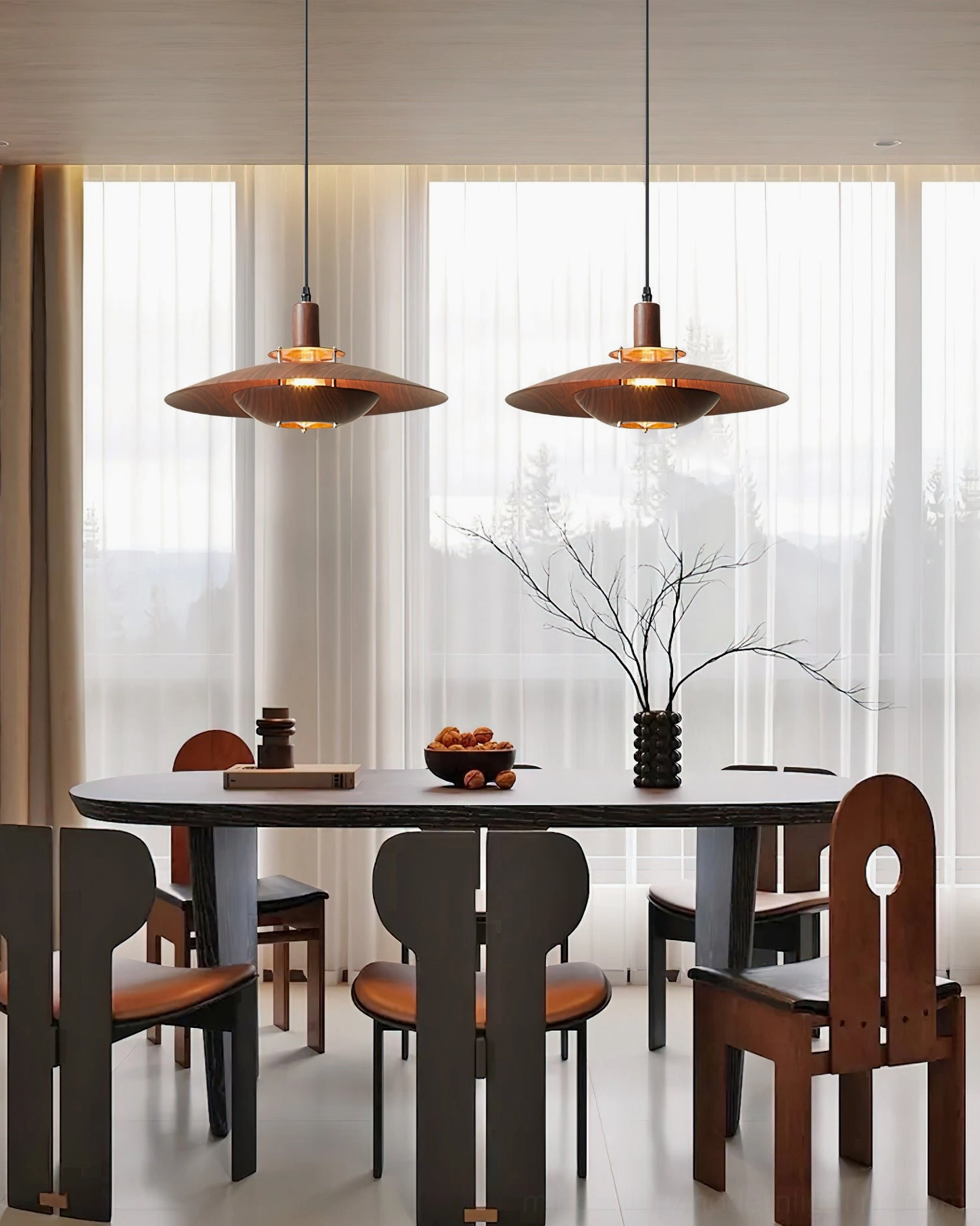 Pair of matching Arturest wood pendant lights in modern dining room with floor windows, cozy minimalist interior design