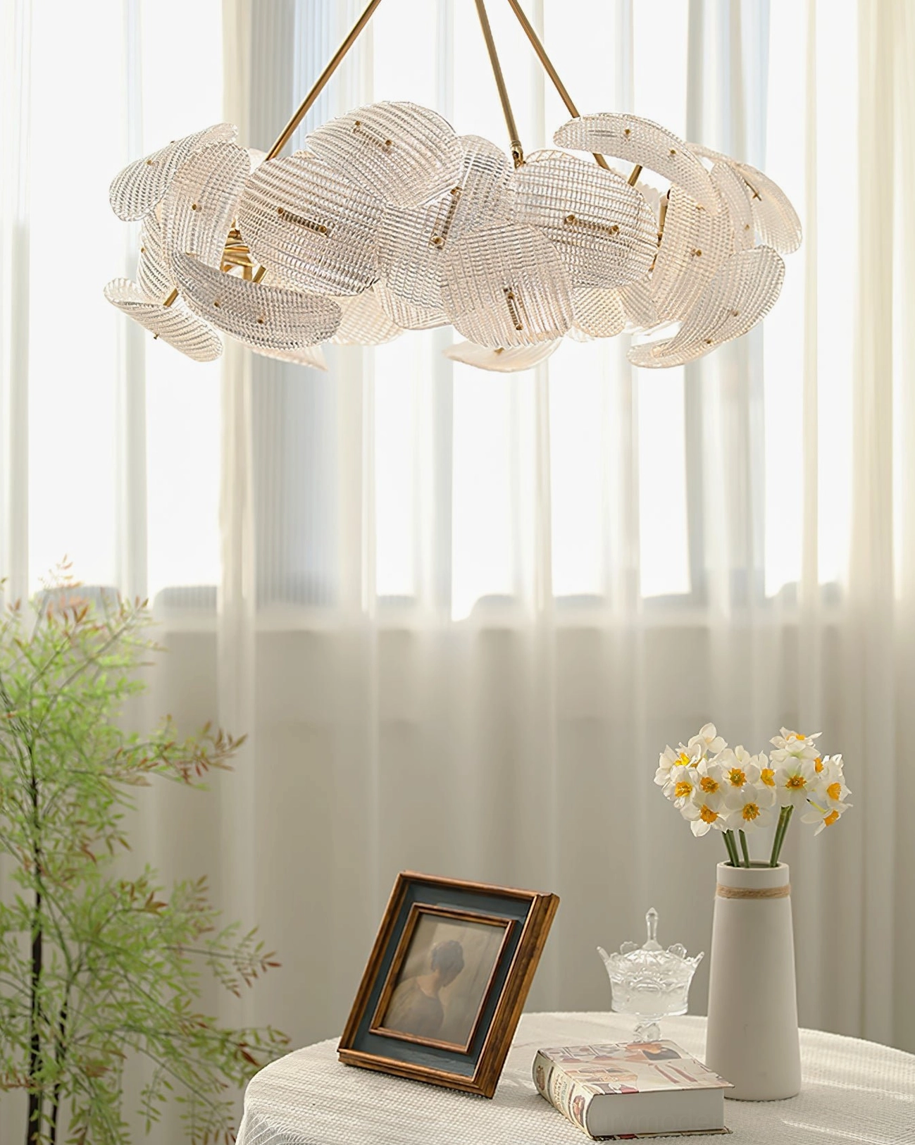 Aster modern minimalist chandelier overhead view dining corner sunlit