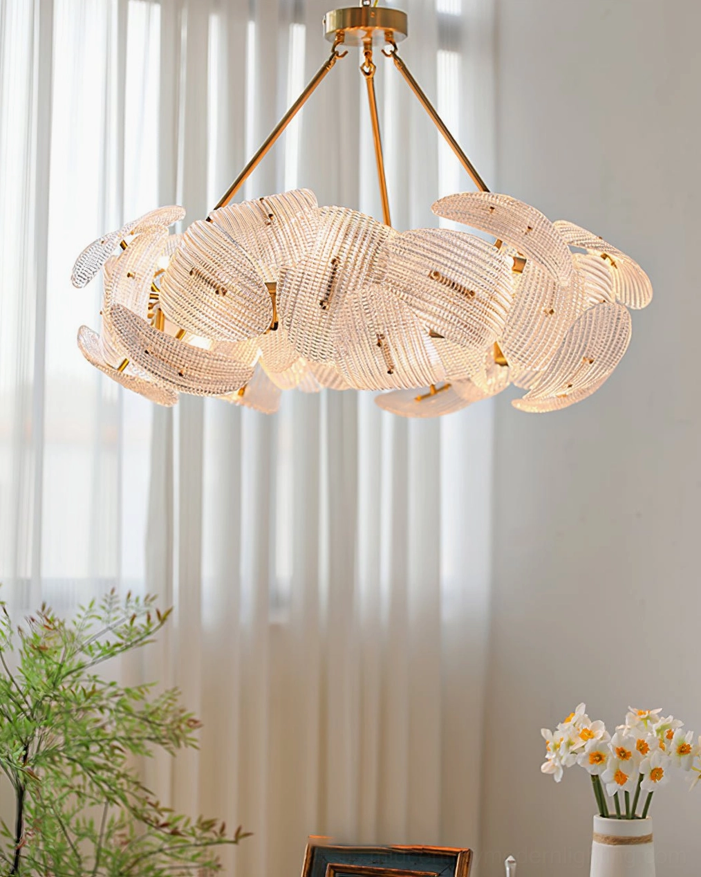 Aster warm glowing chandelier illuminated glass shades brass metal warm tone