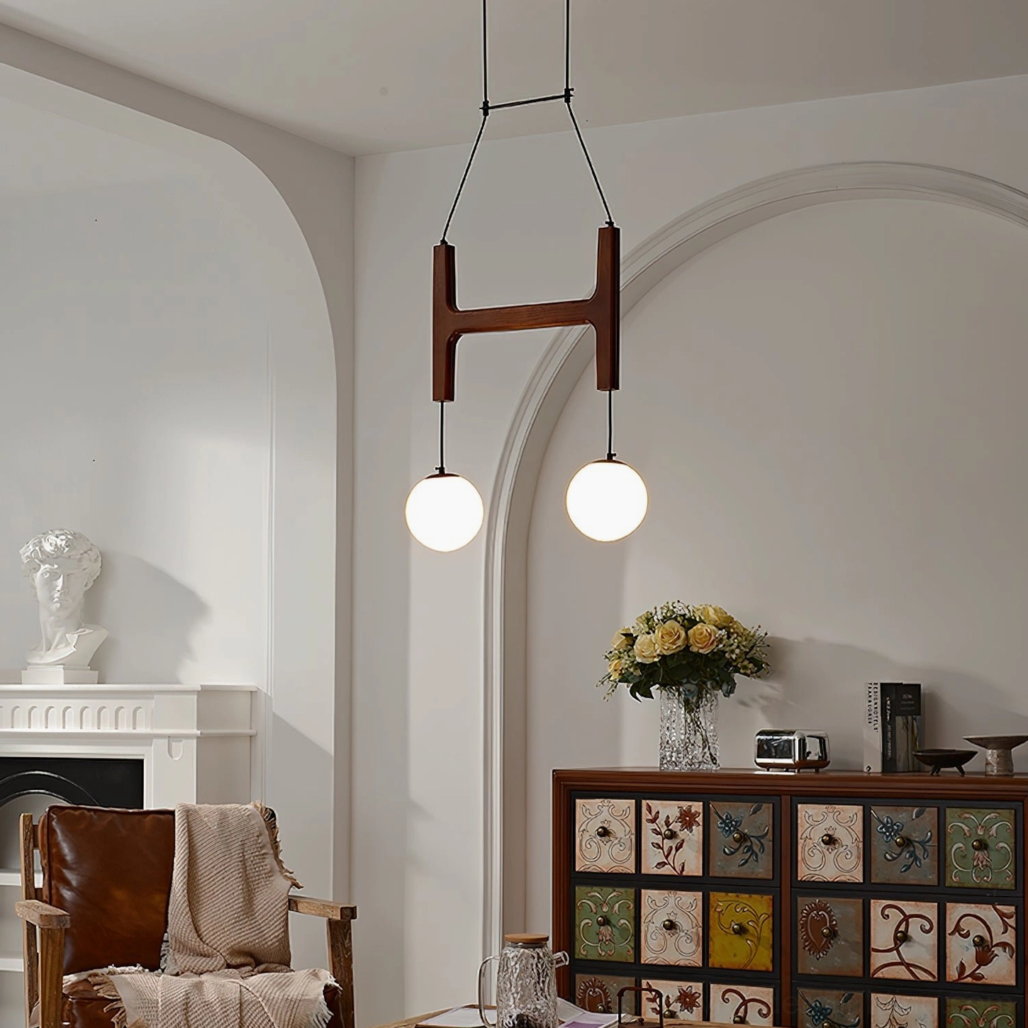 Astra 2-head wooden chandelier with single large frosted globe in minimalist modern interior space