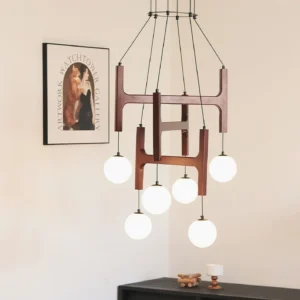 Astra 6-head wooden chandelier with warm white globe lights in modern residential living room interior design setting