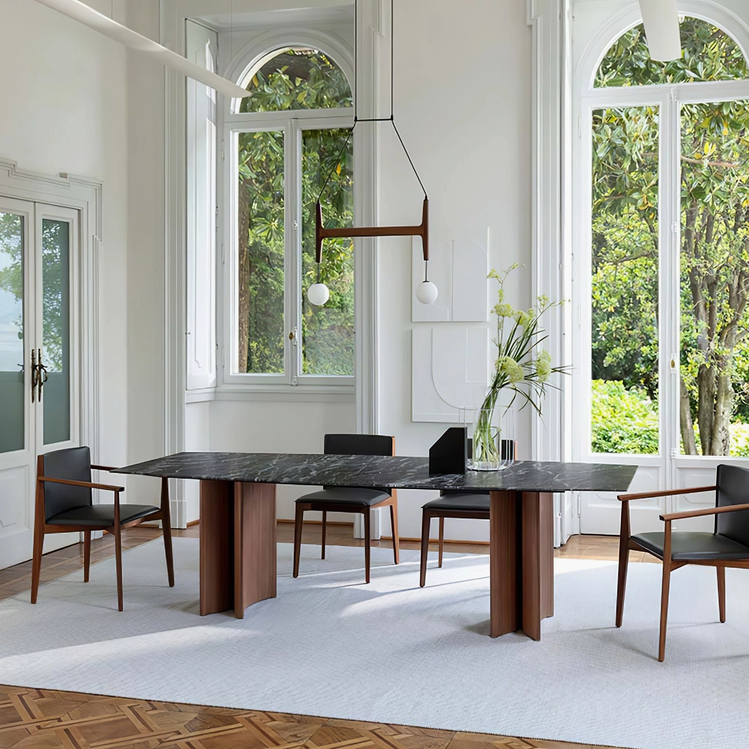 Astra mid-century wooden chandelier suspended in luxury dining room with arched windows and natural daylight