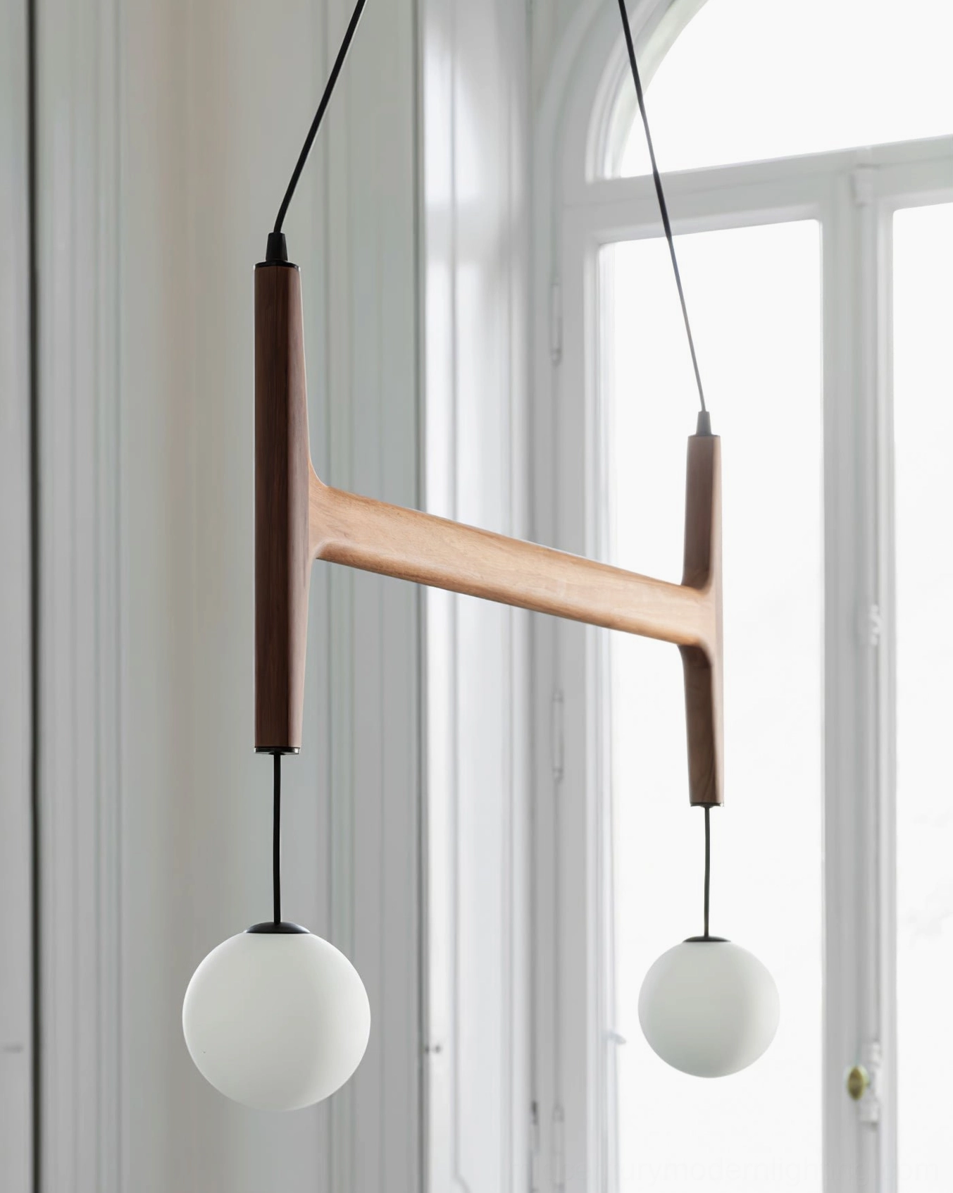 Astra geometric wooden chandelier showing frame design and frosted glass shade configuration detail