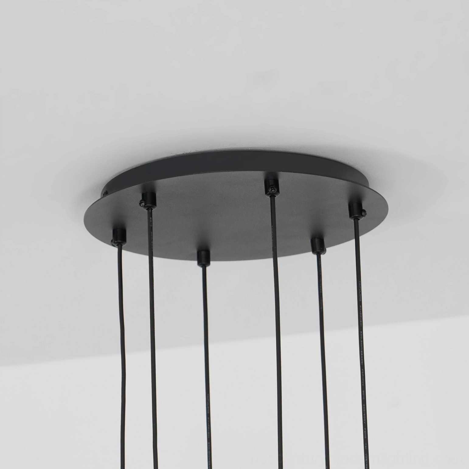 Astra mid-century modern wooden chandelier showing geometric frame and warm white bulbs interior view