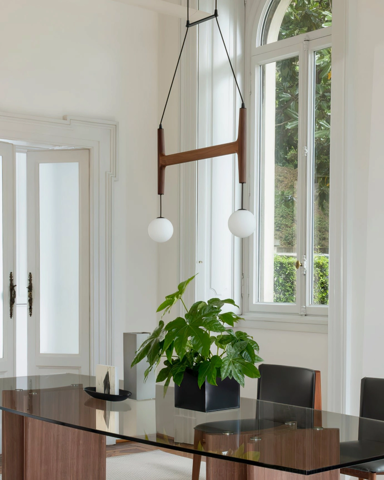 Astra wooden pendant chandelier with multiple frosted globe lights in contemporary dining or living space