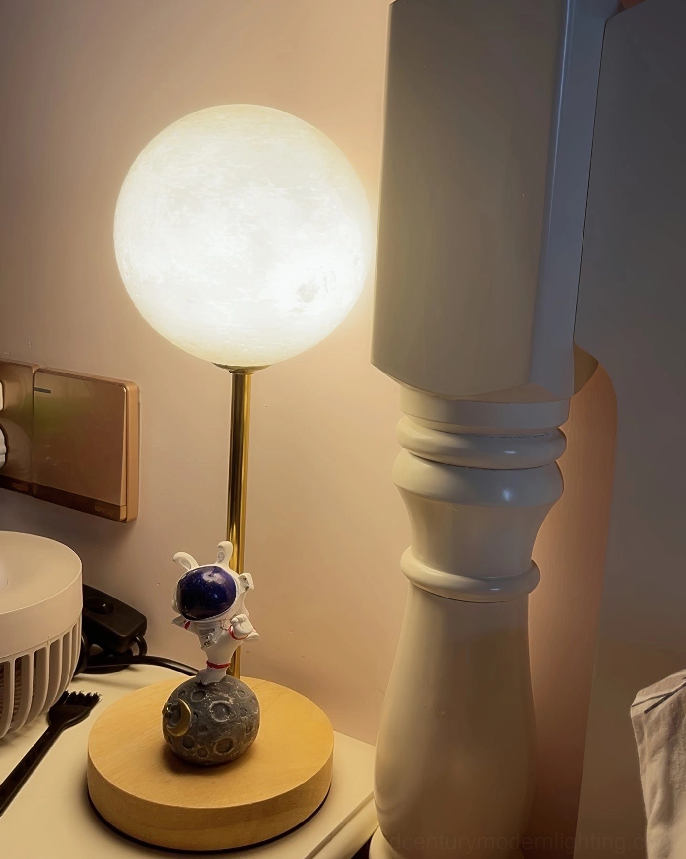 Astronaut moon lamp mid-century modern design aesthetic showing retro space age inspiration and contemporary styling