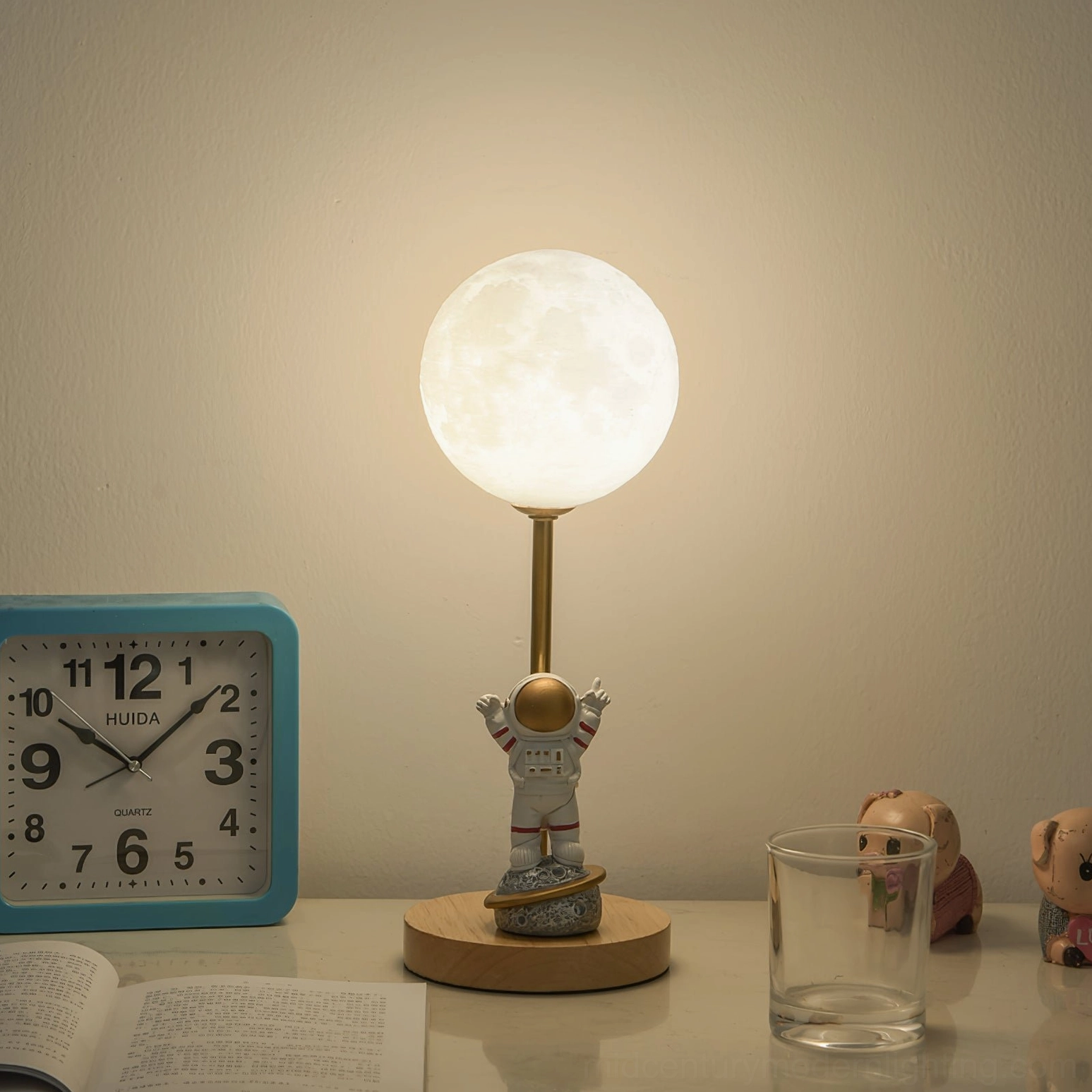 Astronaut moon table lamp in minimalist modern interior showing design compatibility with contemporary home decor