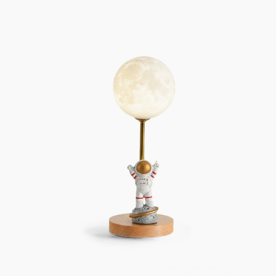 Astronaut moon table lamp with wooden base and LED light, front studio view showing detailed resin astronaut figurine and white lampshade on white background