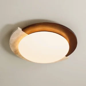 Close-up eye-level view of asymmetrical ceiling lamp mounted on beige wall showing walnut wood and travertine details