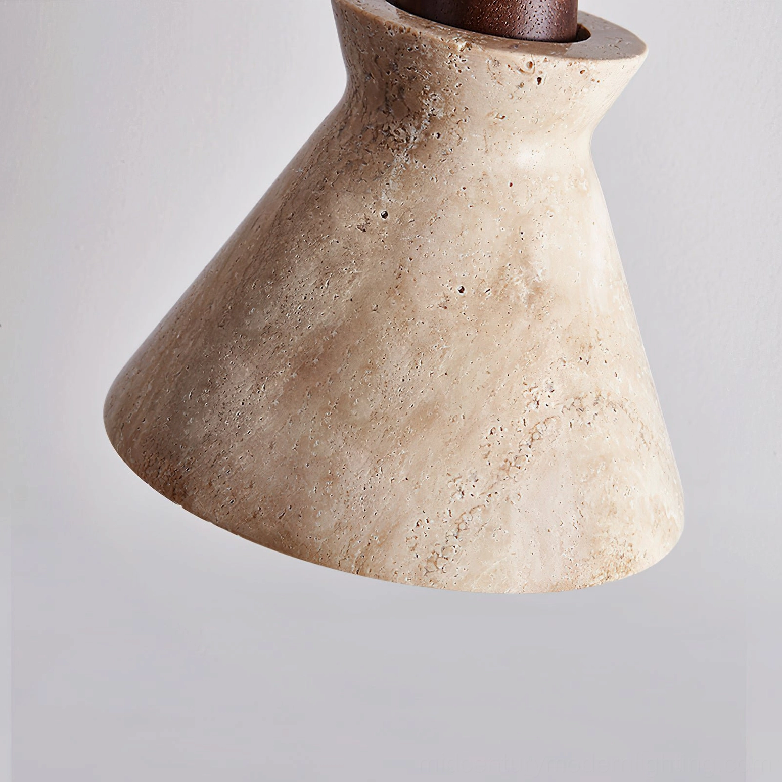 Athena travertine pendant light showing geological natural pitting, architectural detail