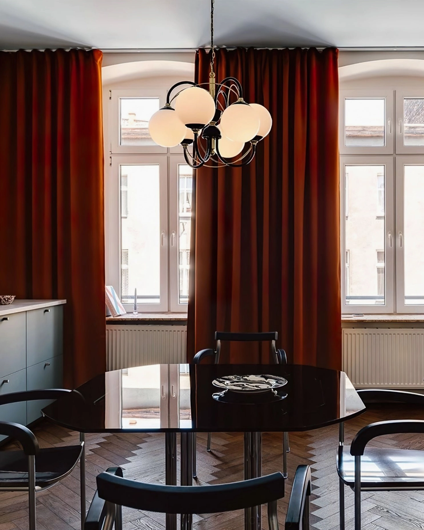 Atomic Orbit mid-century modern chandelier in contemporary home office setup with focused task lighting