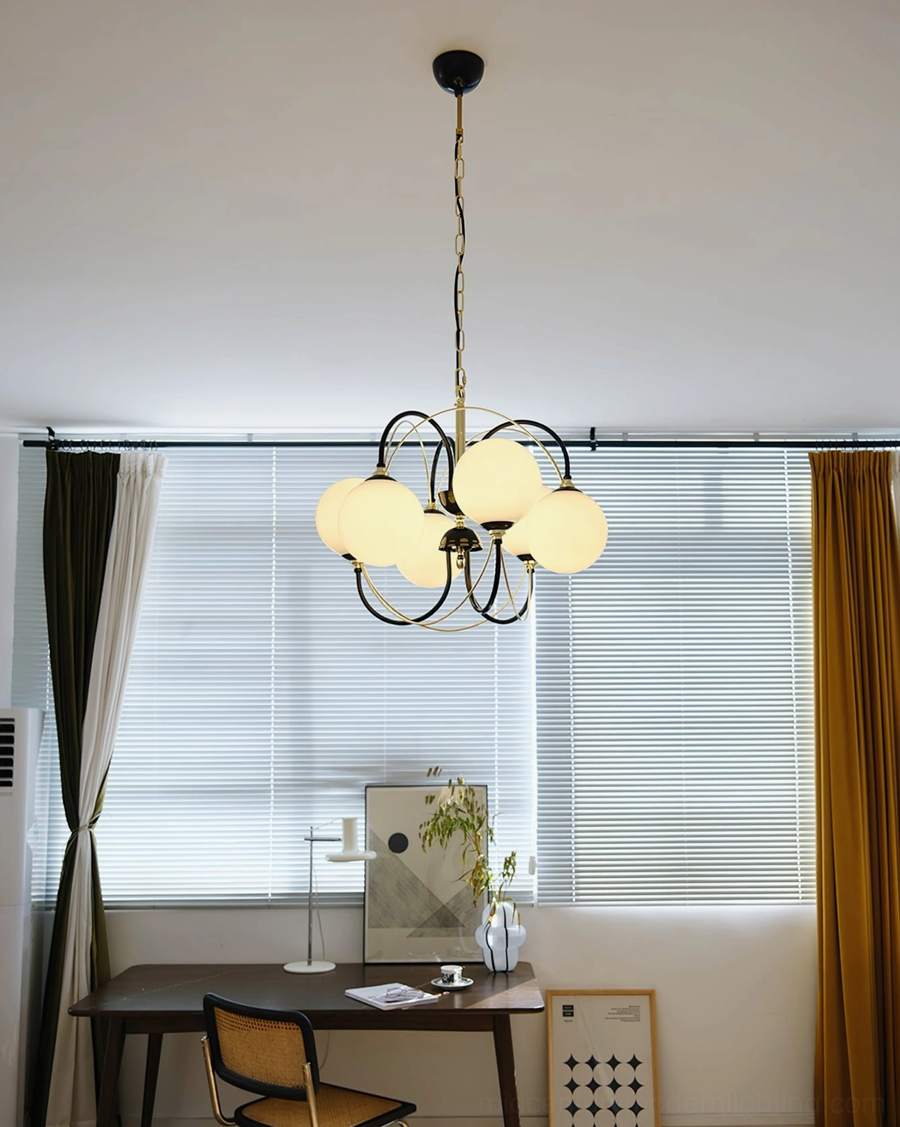 Full room view of Atomic Orbit chandelier illuminating modern loft interior with industrial design elements