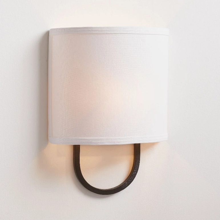 Black Atticus mid-century modern wall sconce with rectangular off-white shade, minimalist design frontal view