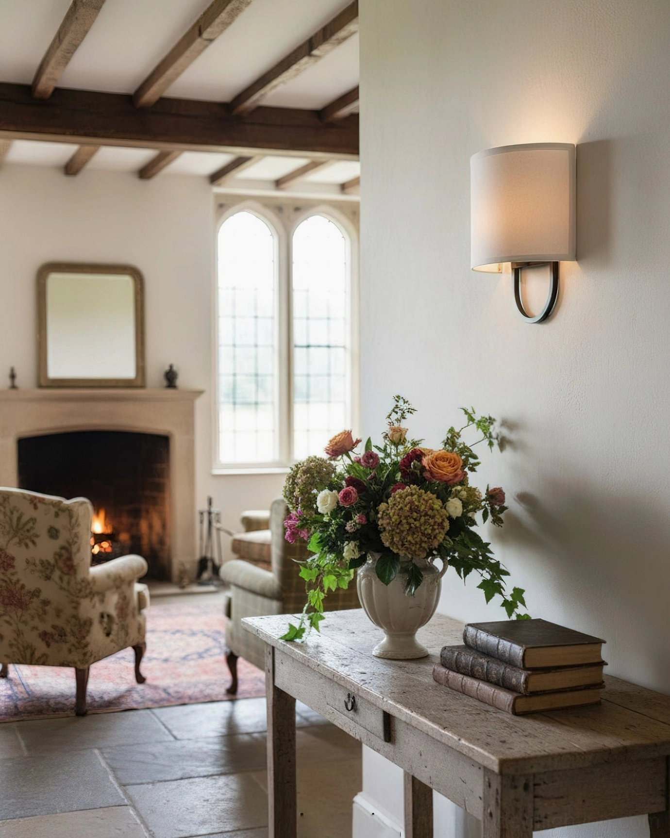 Black Atticus wall lamp with dark bronze U-bracket and muted beige fabric shade, side interior perspective