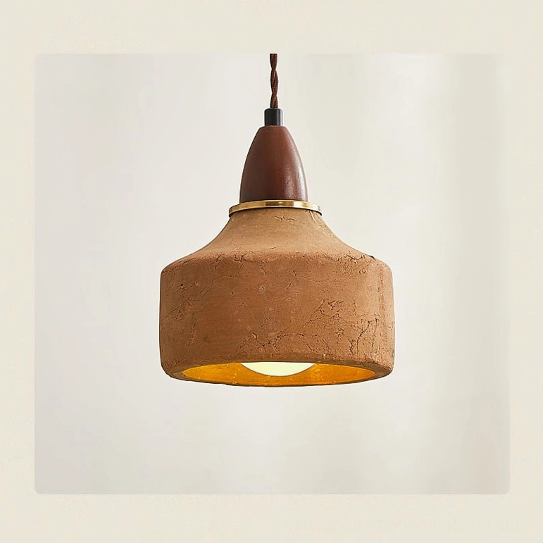 Close-up front view of Auburn ceramic pendant with brass accent ring and rough textured surface