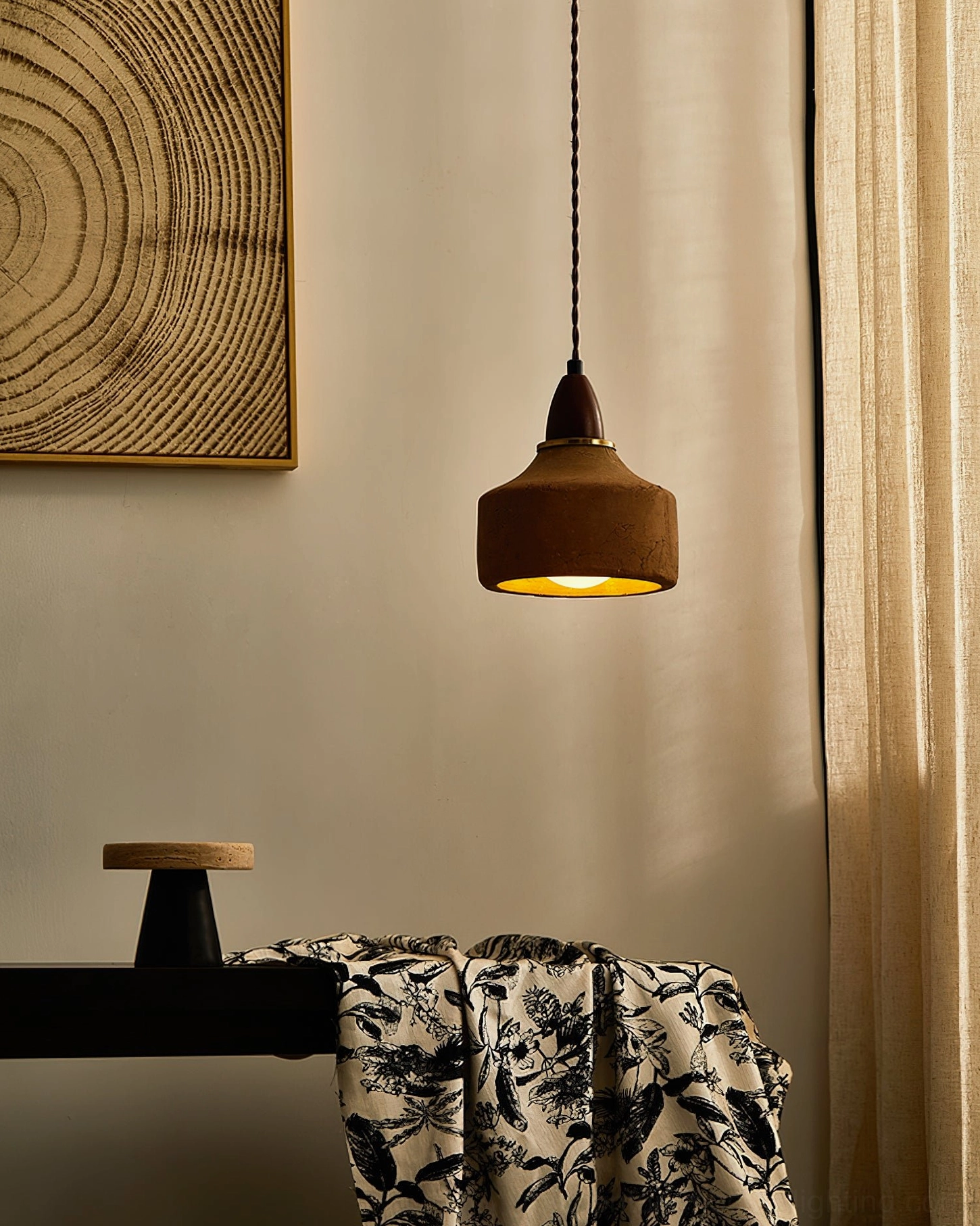 Auburn illuminated ceramic pendant light showing interior warm glow through open bottom