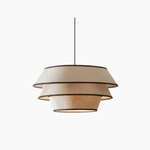 Auden tiered pendant light with beige linen shade and black trim, front view on white background