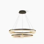 Aura modern geometric tiered acrylic pendant chandelier with matte black frame and gold accents on white background studio shot