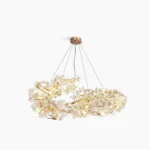 Aurea Art Deco crystal chandelier with polished brass frame and frosted glass, studio front view showcase