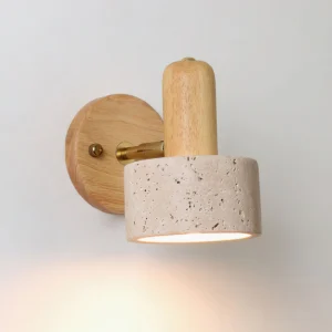 Aureole wall light side profile showing brass fixtures and beige travertine stone shade detail