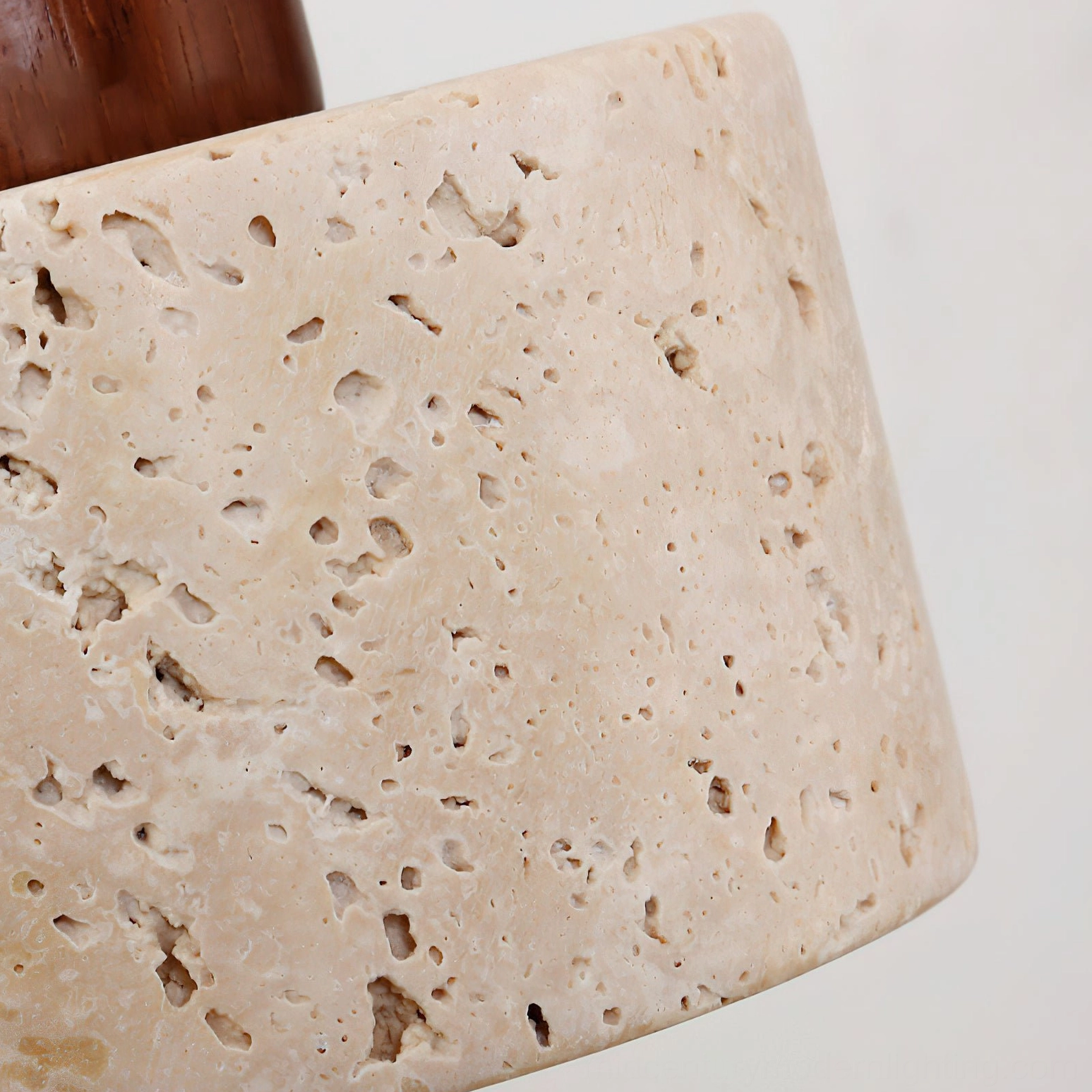 Aureole travertine shade macro close-up showing natural stone pores and earthy beige texture