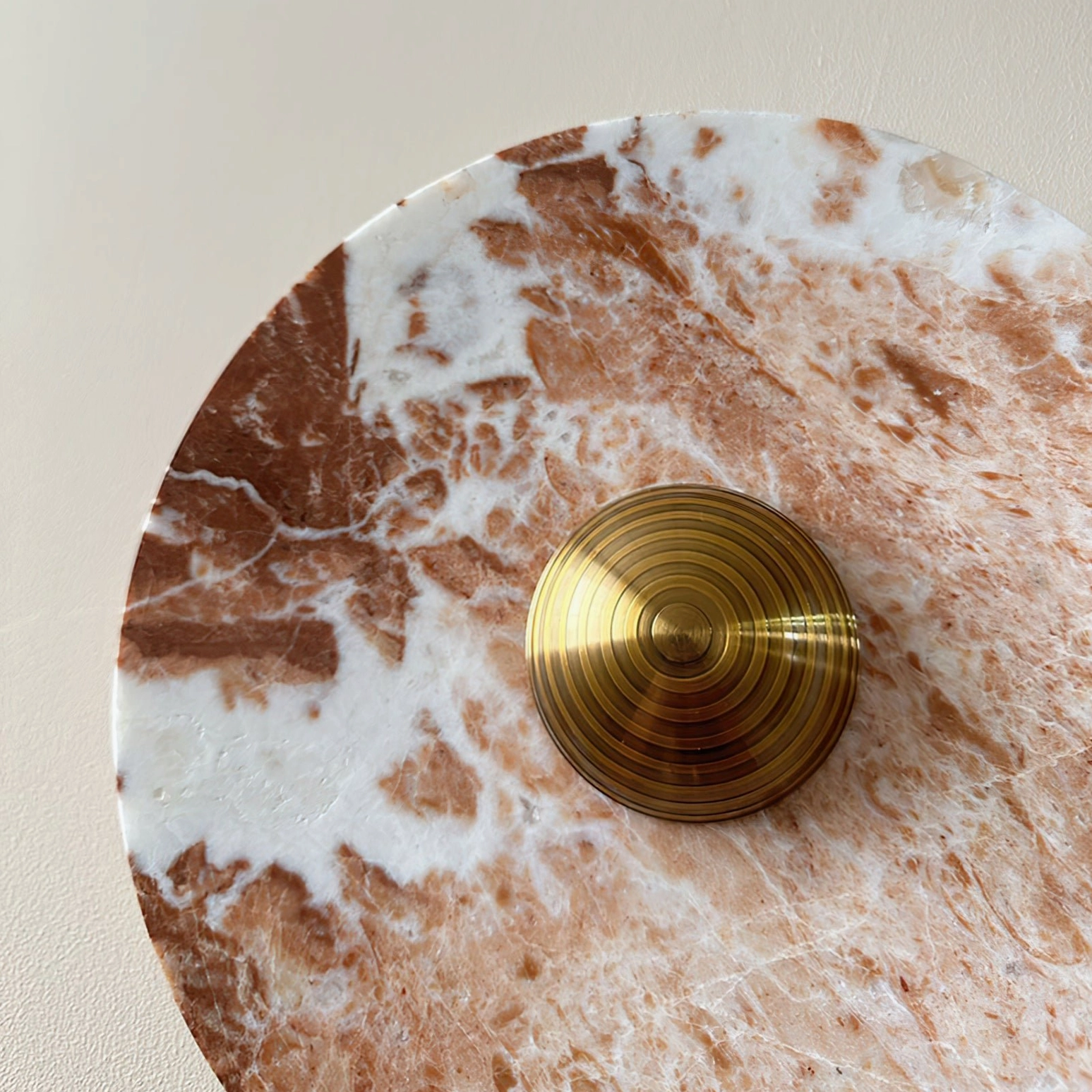 Extreme close-up of Aurora marble lamp base showing detailed natural stone grain and polished surface