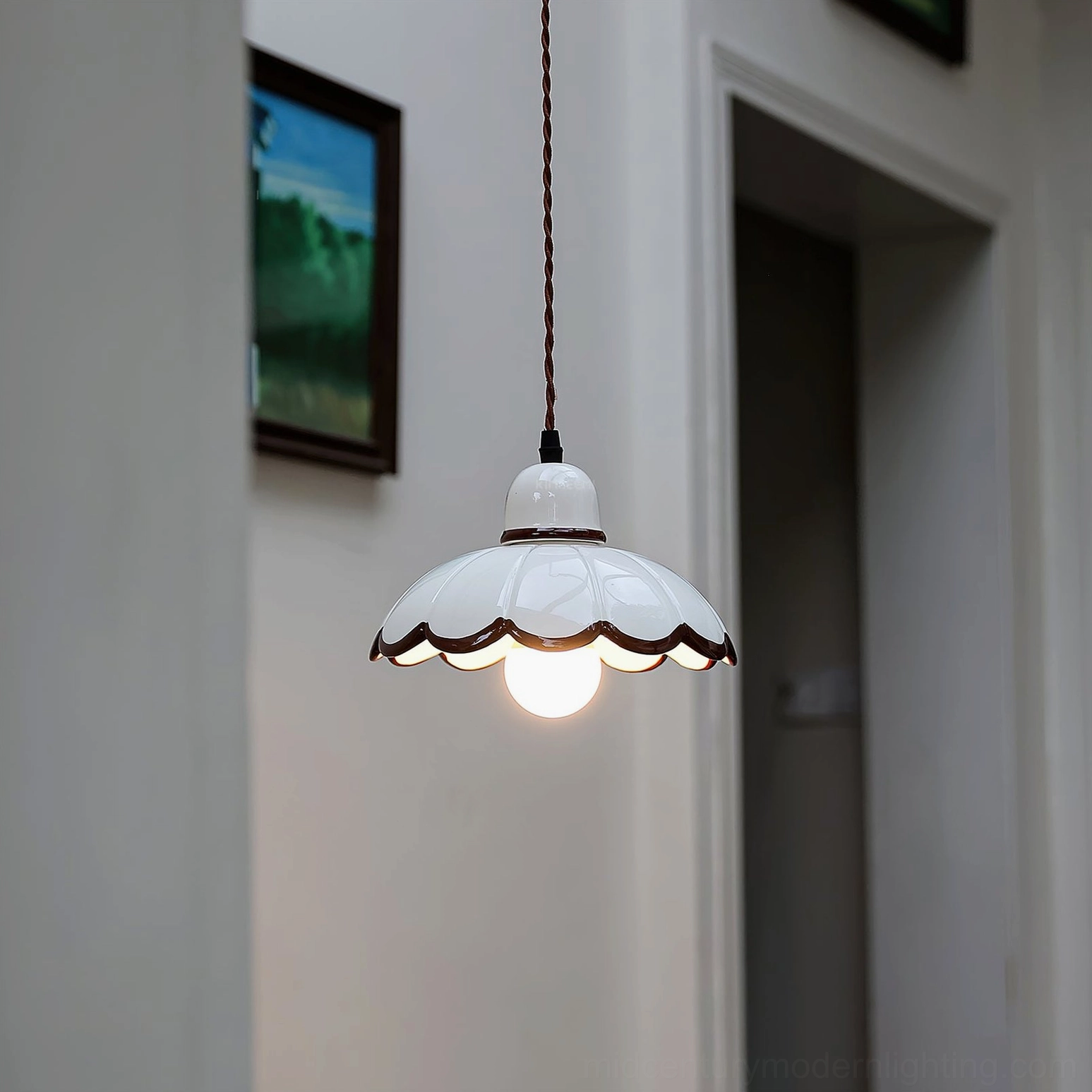 Avalon ceramic pendant light in minimalist hallway with framed wall art