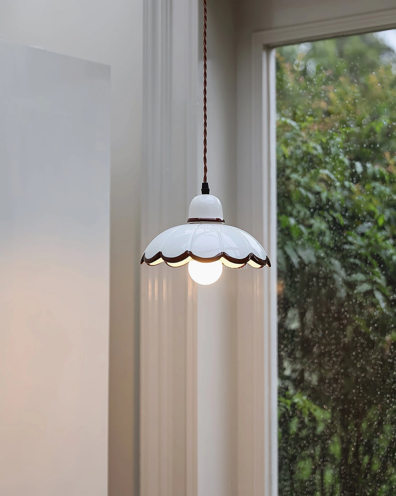 Avalon pendant light interior space with green foliage visible through window