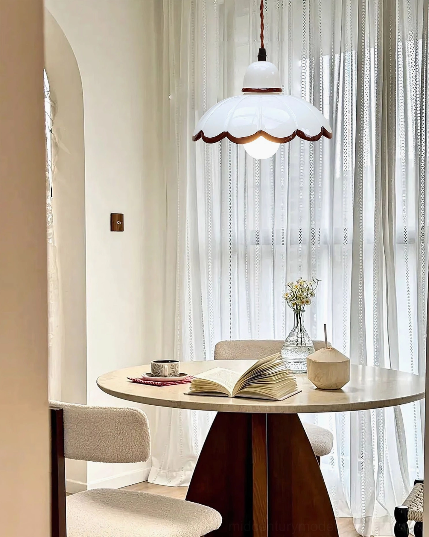 Avalon pendant lights above dining table in cozy home interior with decor