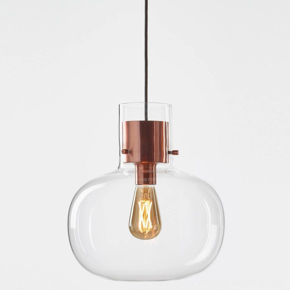 Awa pendant light with cognac glass diffuser, warm color temperature, cozy ambient atmosphere