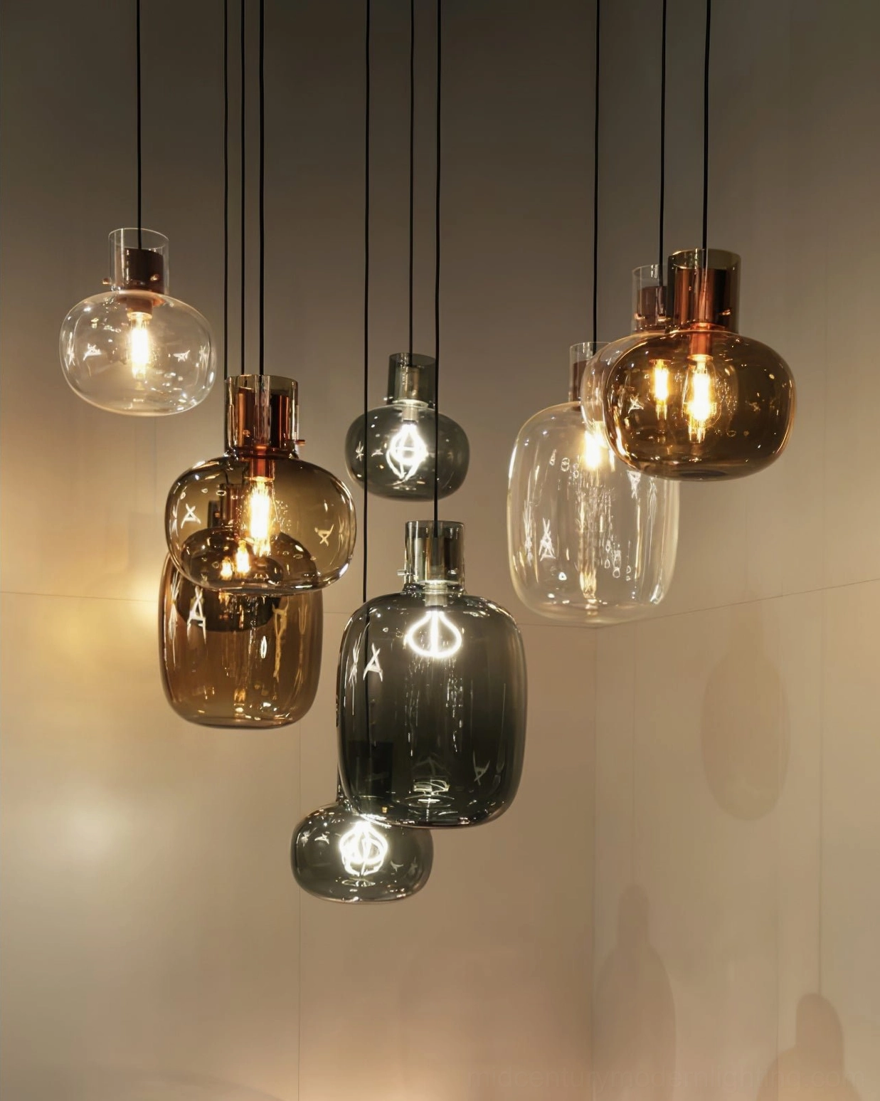 Cluster of Awa pendant lights in mixed sizes with cognac and smoke grey glass, warm ambient lighting, Nordic industrial interior design