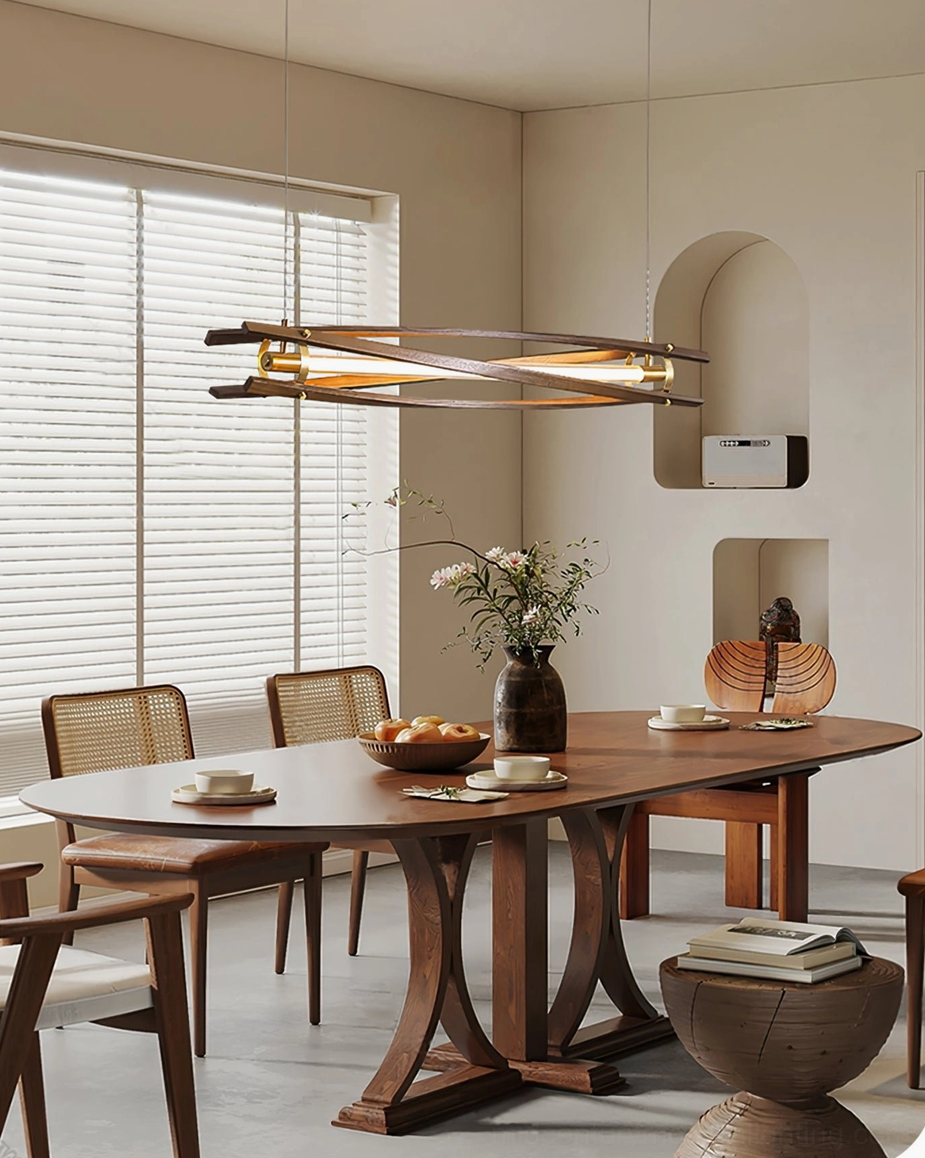 Modern wood and brass chandelier in minimalist home setting displaying sculptural pendant light design