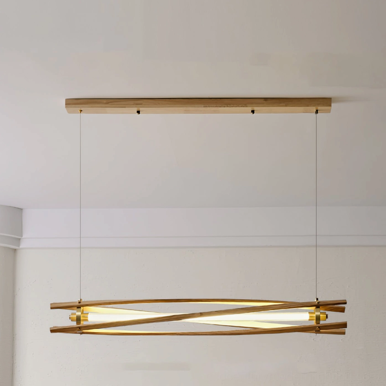 Axis wood pendant light from low frontal angle showing geometric wooden framework and warm LED illumination