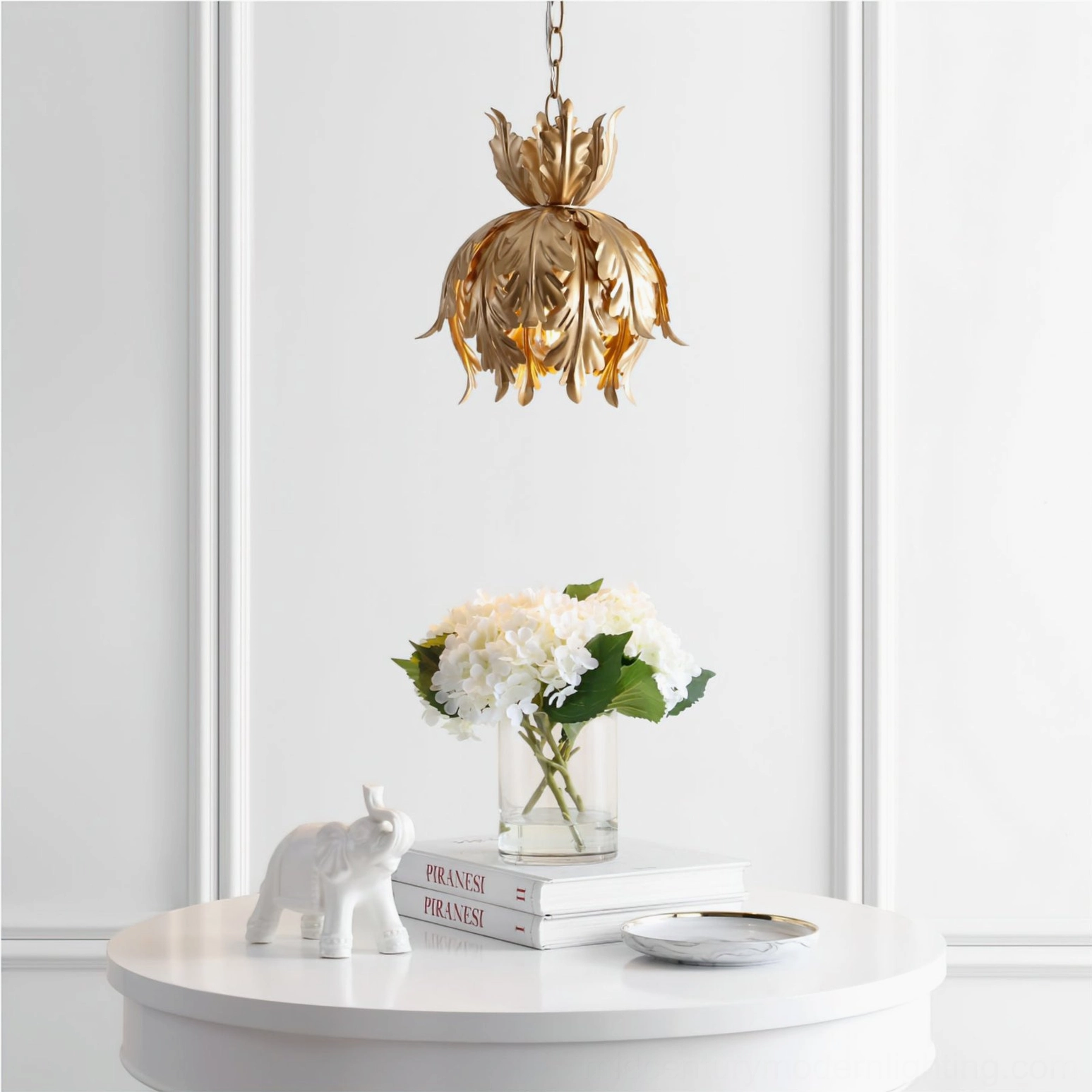 Azalea pendant light installed in elegant neoclassical white entryway with luxury home decor and table styling